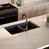 Soapstone Mist Concrete Quartz Engineered Quartz in a kitchen
