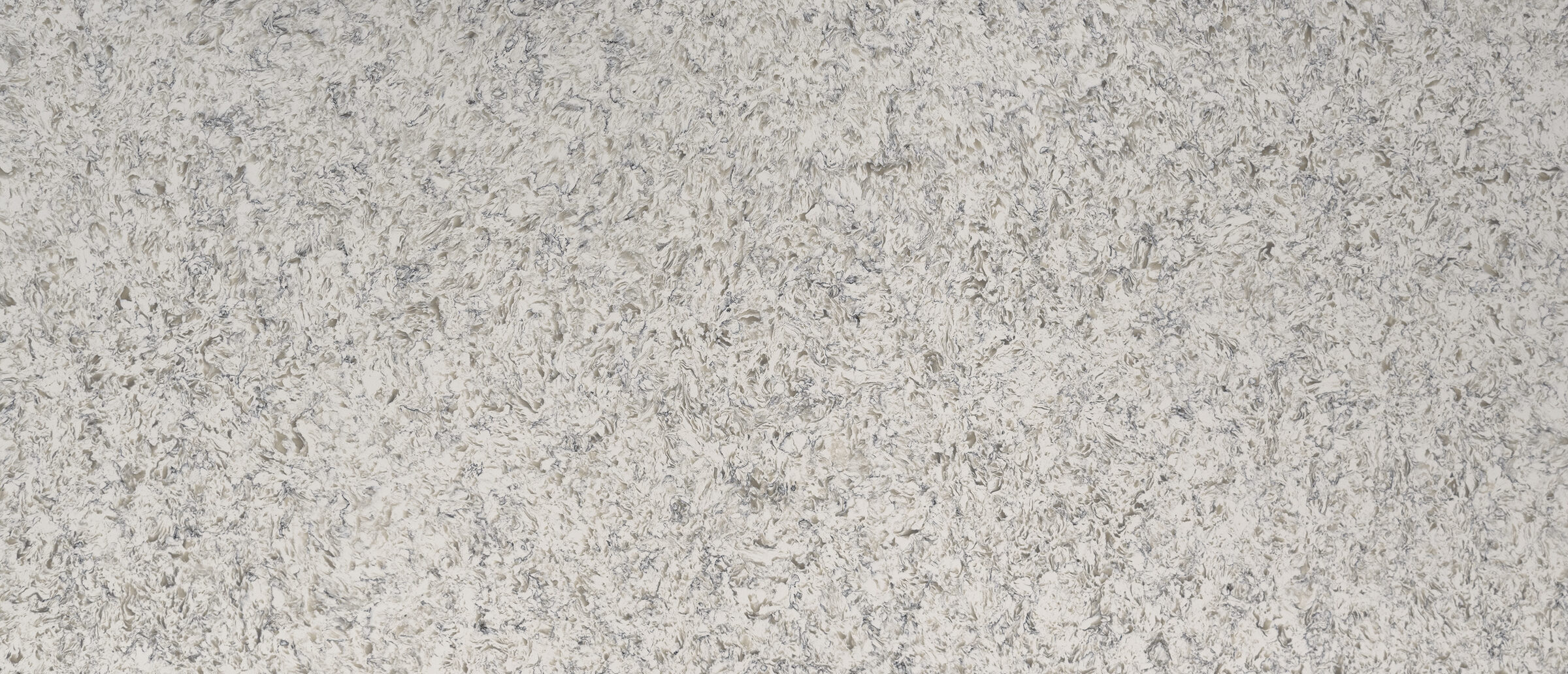 Crisp white quartz countertops in a bright suburban kitchen