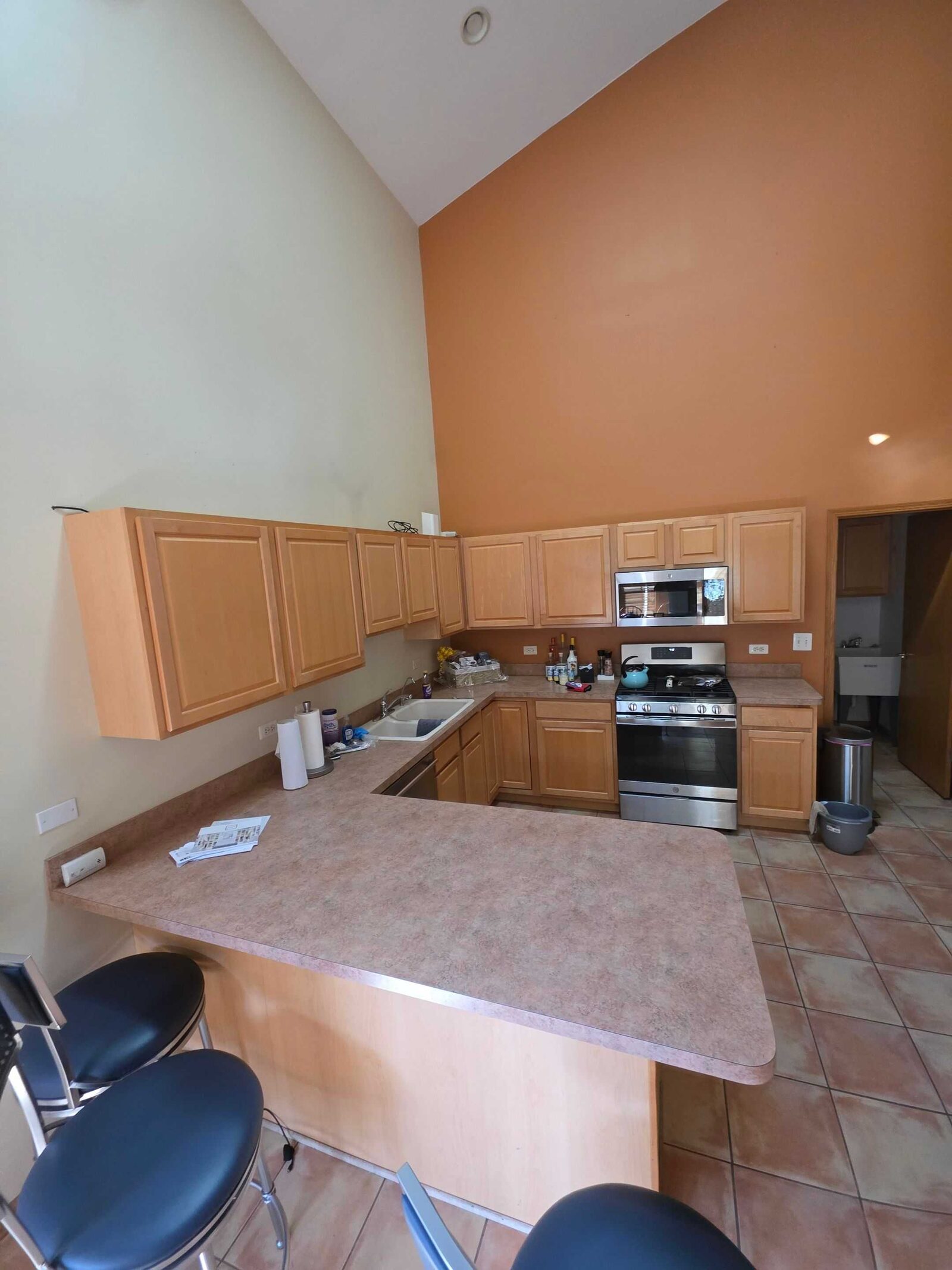 The same peninsula before, in tan laminate with a rounded front edge